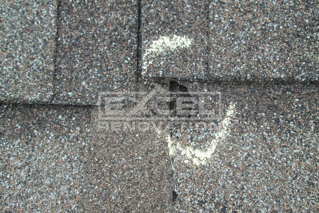 Hail Damage On Asphalt Shingles: Pictures, Signs, & Repairs 4 Holes on shingles